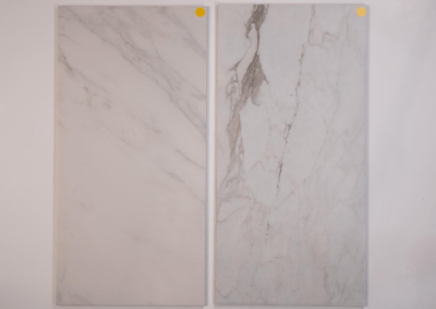 A pair of white marble tiles on a white background, perfect for custom home builders in Southern Utah Valley.