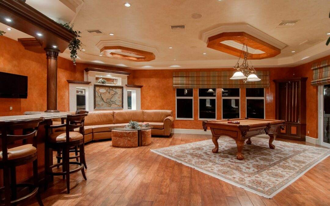 A custom-built living room in a Riding Homes with a pool table and bar.